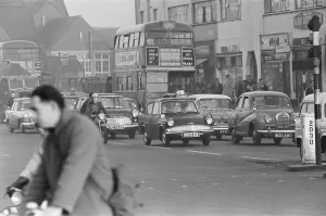 Traffic in High Street Dagenham as the Ford factory turns out at the end of the day shift