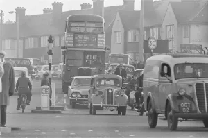 Traffic in High Street Dagenham as the Ford factory turns out at the end of the day shift