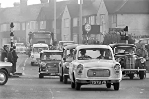 Traffic in High Street Dagenham as the Ford factory turns out at the end of the day shift