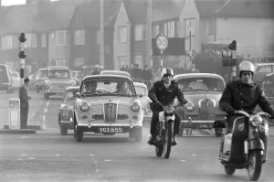 Traffic in High Street Dagenham as the Ford factory turns out at the end of the day shift