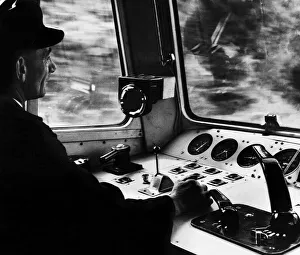 Rail Prints: Train driver Charles Dutton in the cab of the electric express locomotive train