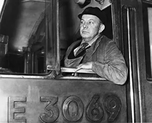 Train driver Tommy Heywood in the cab of his British Rail express Class 85 electric