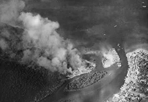 01455 Prints: The trans-shipment base at Chumphon on the Kra Isthmus ablaze during a raid by RAF