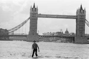 Adventurer Prints: Transglobe expedition leader Sir Ranulph Fiennes walks across the River Thames near Tower
