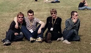 Images Dated 1st July 1999: Travis at T in the Park sitting on the grass 2 members are smoking July 1999
