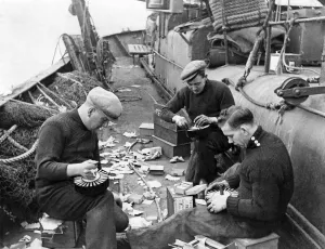 Trawlermen Gunner Liston, (Right) Jamieson (Left) and Steel, aboard the North Sea trawler