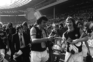 F A Cup Prints: Trevor Brooking and Kevin Locke with the FA Cup 1975 after West Ham had beaten
