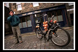 Trevor Walls May 1999 standing beside a Velo Solex motorcycle