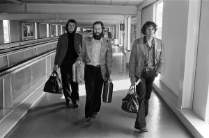 A trio of British mountaineers leave Heathrow Airport to try