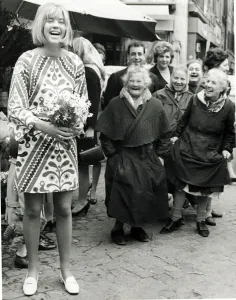 Trisha Locke wearing a short skirt in Rome Italy seen with local flower sellers