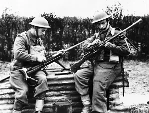 Troops from the 1st Border Regiment at Rumegies cleaning a Boys anti-tank regiment