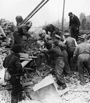 Bombing Prints: Troops assist rescue workers to release bomb victims trapped under the ruins of their