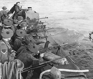 Machine Gun Prints: Troops a board a landing craft give covering fire during combined operations training