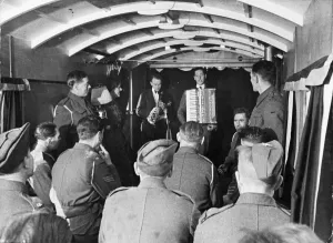 Troops in Bridport, Devon, are entertained in a mobile theatre