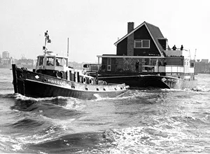 Weird Prints: A tug boat hauling a floating home along to its new site on the River Thames September