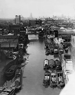 01035 Prints: Tugs, lighters and barges moored to the staithes awaiting to unload their goods into