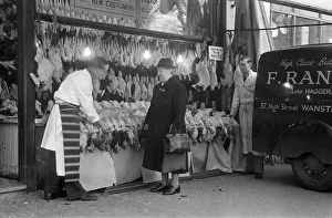 00513 Prints: Turkeys for sale in F. Range butchers on the High Street in Wanstead, London
