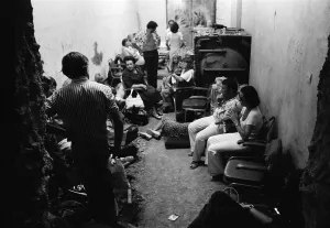 Holidaymakers Prints: The Turkish invasion of Cyprus. Guests crowd together in the basement area of the Ledra