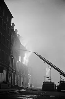Smoke Prints: A turntable ladder of the London Fire Brigade tackles fires on Aldersgate Street