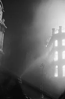 A turntable ladder of the London Fire Brigade tackles fires on Aldersgate Street