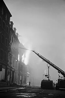 01496 Prints: A turntable ladder of the London Fire Brigade tackles fires on Aldersgate Street