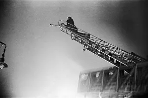 A turntable ladder of the London Fire Brigade tackles fires close to Waterloo railway