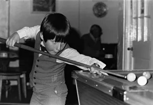 Waistcoat Prints: The Tuxedo Kid 8 year old Mark Kiernan seen here at the pool table. 25th September 1984
