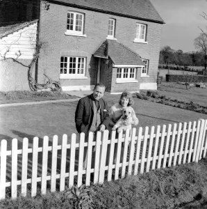 TV actor Hugh Lloyd seen here at home with his wife and pet dog. 1960 A1098-005
