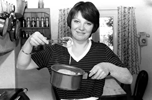 Domestic Life Prints: Tv cook Delia Smith at home in kitchen 1981 Mixing with a whisk