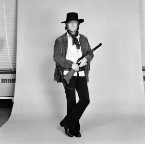 TV personality Michael Parkinson dressed in cowboy attire. 28th September 1972
