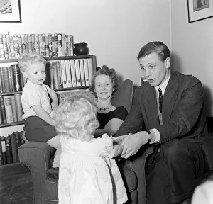 Broadcaster Prints: TV Presenter David Attenborough December 1955 and Wife Jane with their children at home
