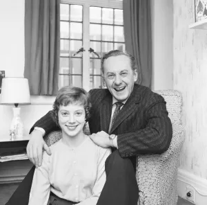Armchair Prints: Tv presenter Hughie Green seen here at home with his 14 year old daughter Linda