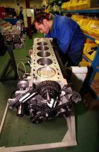 TVR car February 1999 Road Record TVR speed six man looking at the engine