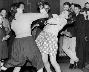 Two twelve-year-old girls fighting as a curtain-raiser'before a children