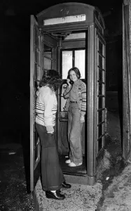 Twelve-year-old Martine Coles makes a call from the phone box in Pontypridd that is going