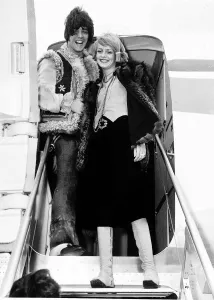 Occupation M Prints: Twiggy model and actress with boyfriend and manager Justin de Villeneuve on steps of