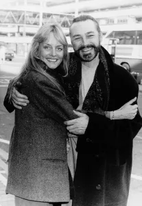 Twiggy Model and Actress with husband Actor Leigh Lawson at Heathrow Airport