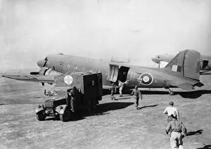 Target Prints: A typhus team of No. 31 Mobile Field Hospital back their Fordson WOT1 Ambulance up to