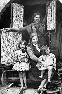 A typical gypsy family at the door of their caravan at the 700 year old fair at Yarm