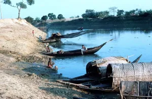 Dramatic Prints: Typical river scene net fishing near Dacca Bangladesh