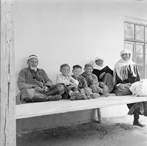 00082 Prints: A typical Uzbeki family dressed in traditional costume pose for the Daily Mirror