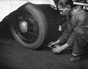 One Man Only Prints: Tyres checked on the assembly line at the Triumph car factory in Coventry