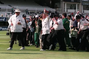 Emotions Prints: Umpire Dickie Bird waves to the crowd at the end of his last match as a Test Umpire in