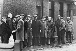 Unemployment Prints: Unemployed miners pictured queuing at the dole at Rhos employment exchange after