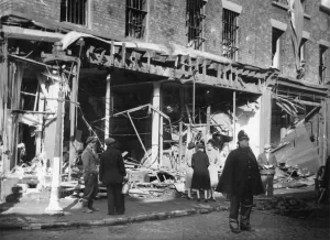 Bombed Prints: The Union Jack (top right) still flying after shops had been damaged by a Nazi air raid