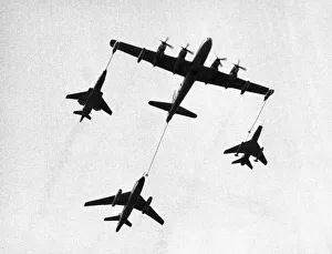 Formation Prints: A United States Air Force tanker refuelling fighter planes during a demonstration