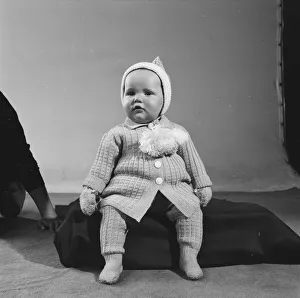 Unknown child model seen here modelling one of the years Reveille knitwear outfits