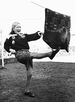 Weird Prints: Unusual Pics Annie Sweeney beats the carpet with a hefty right footer whilst training for