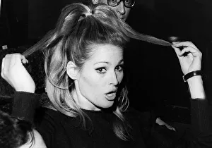 00141 Prints: Ursula Andress actress pulling at hair 1966 during stage rehearsals