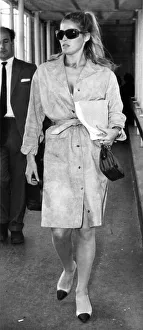 00436 Prints: Ursulas Flying Fashion: Actress Ursula Andress is pictured here leaving London
